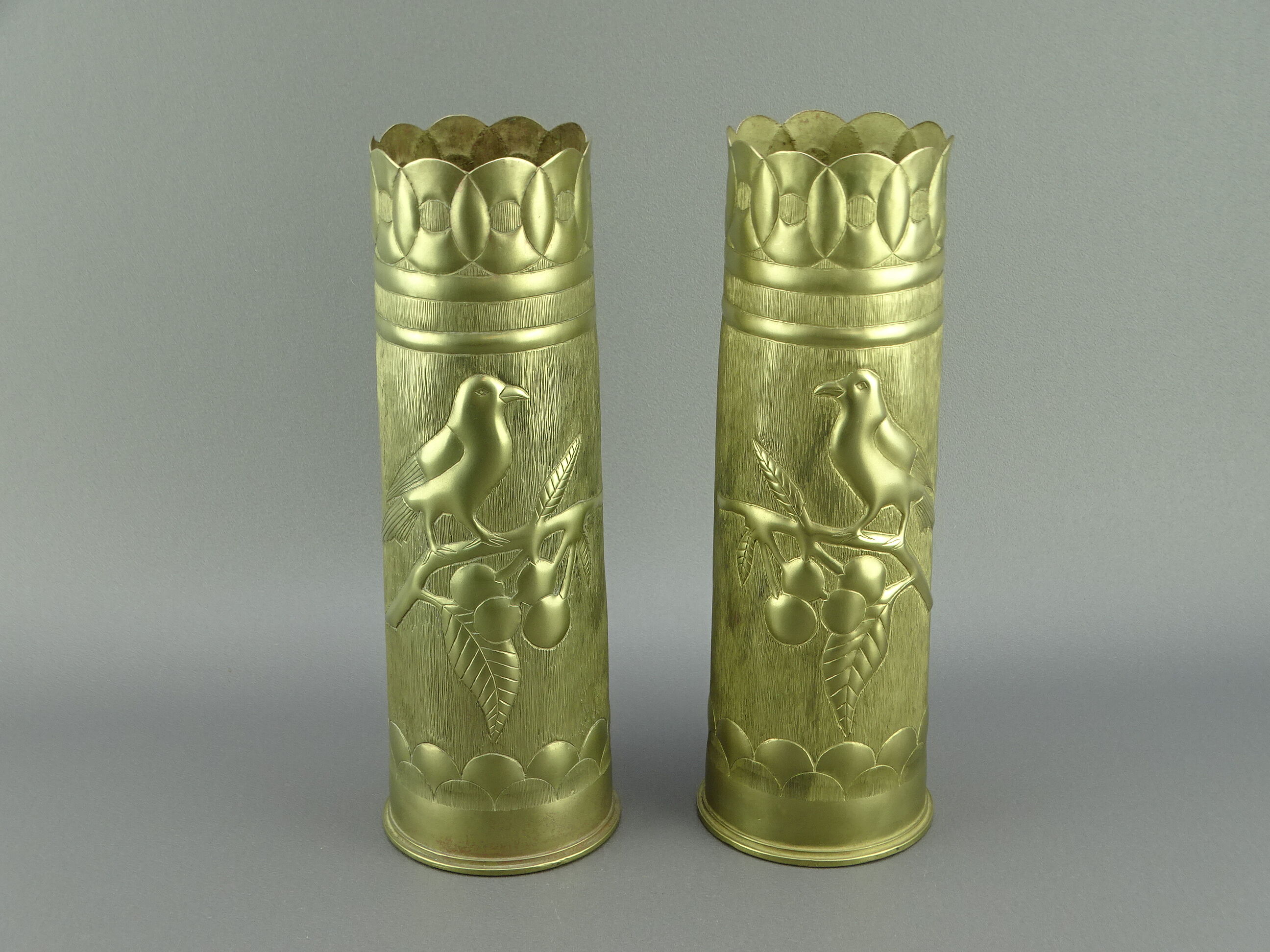 Pair of shell casings forming repulsed copper vases