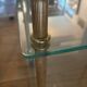 Elegant wheeled serving trolley in gilded brass and glass, in a spirit