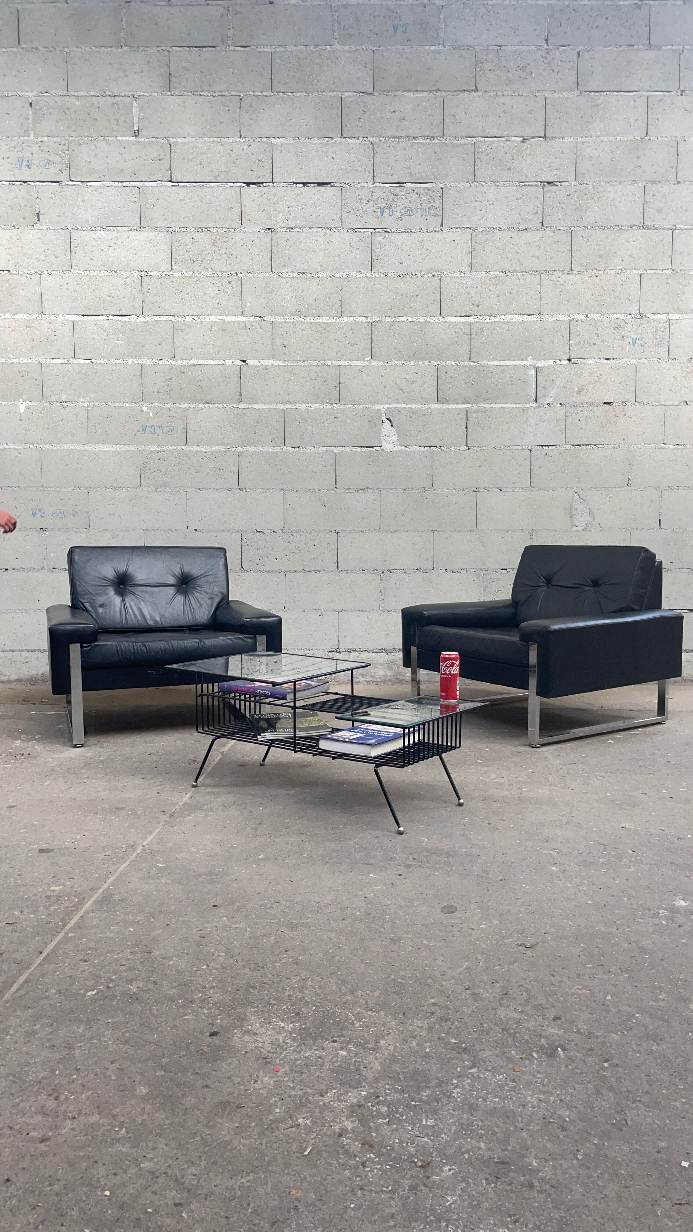 Pair of black leather armchairs