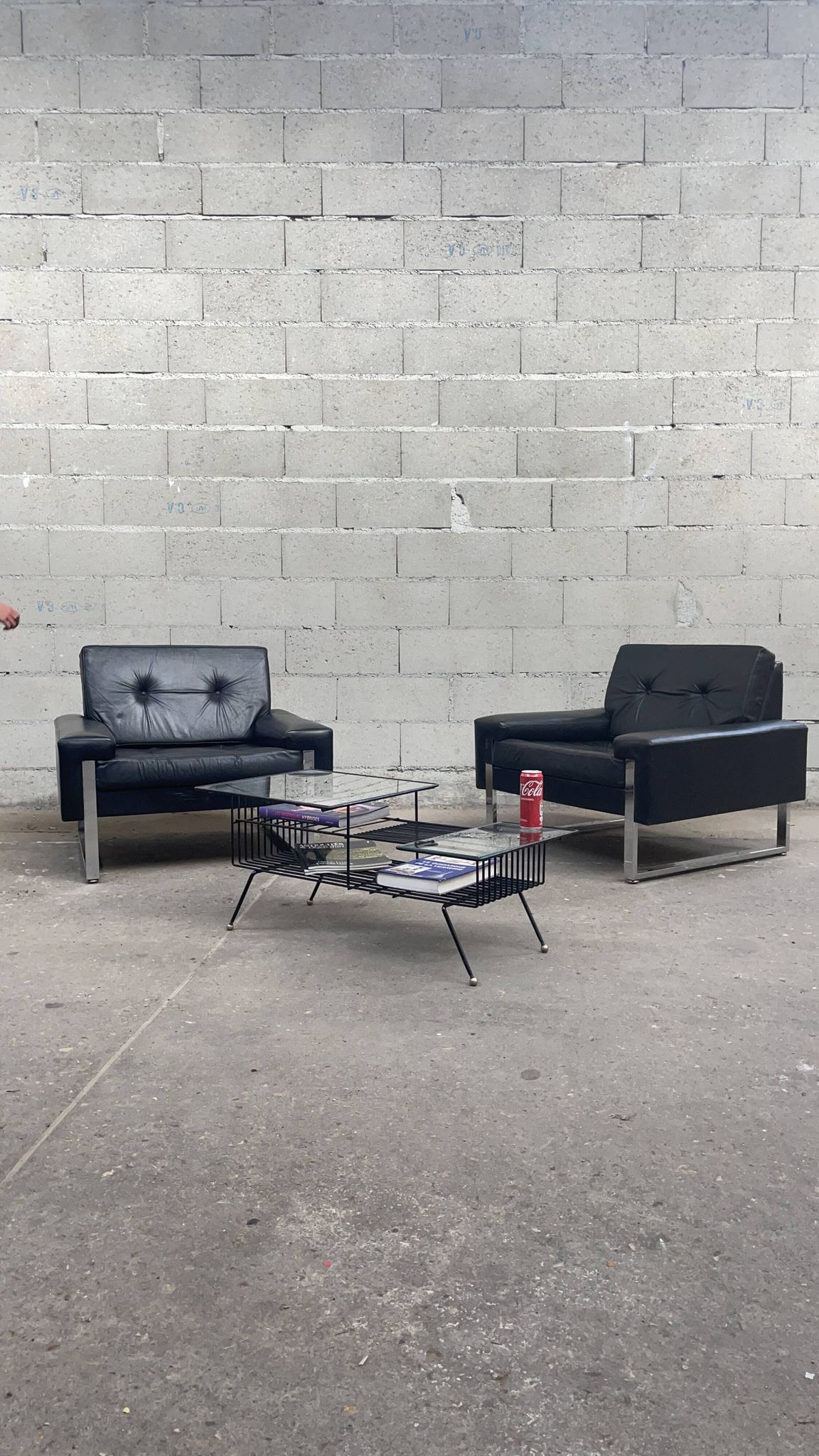 Pair of black leather armchairs