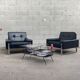 Pair of black leather armchairs