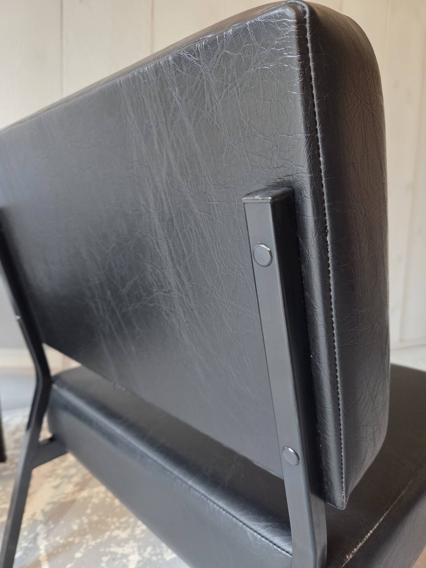 2 faux leather armchairs