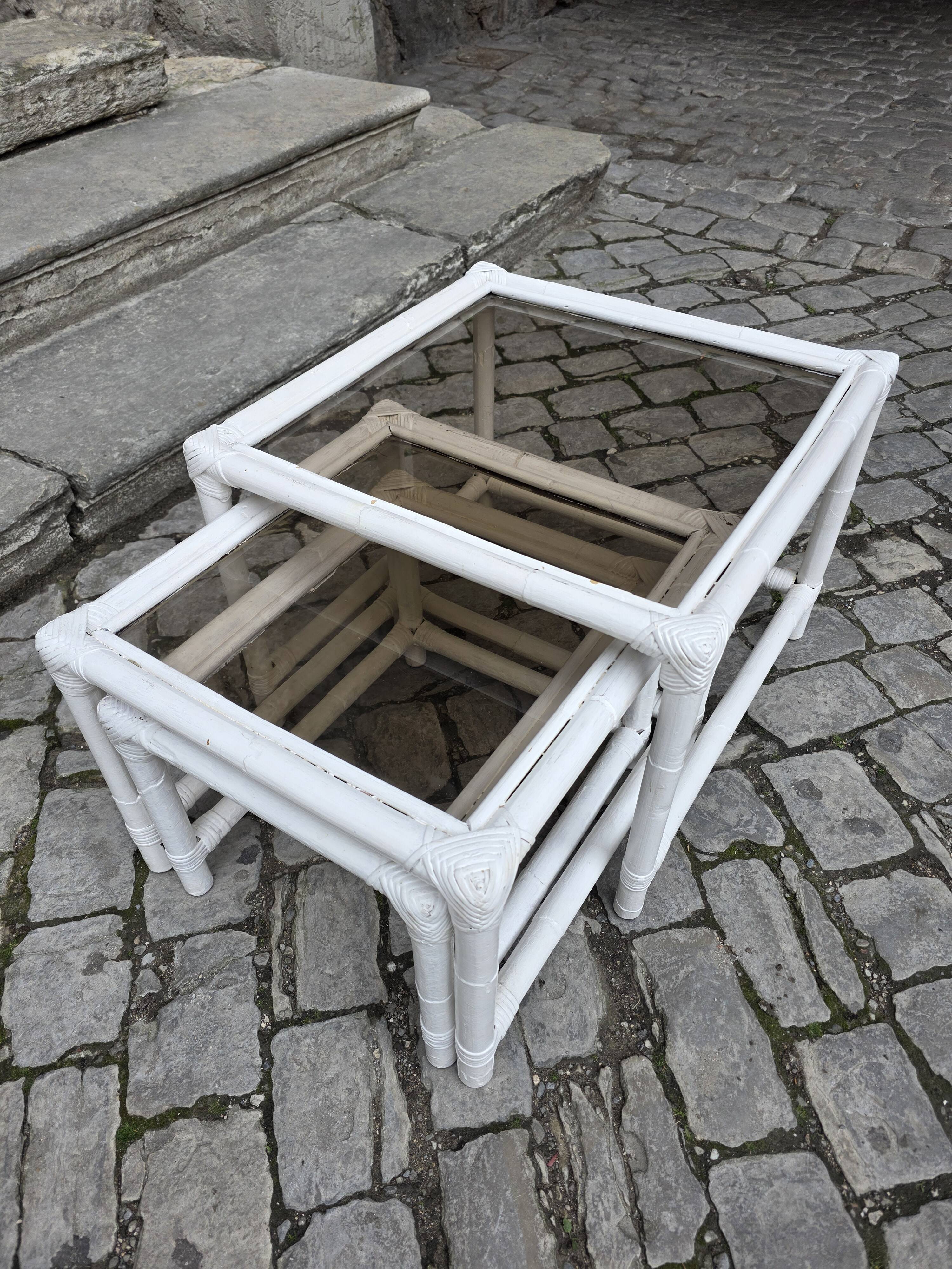 Nest of bamboo and smoked glass tables from the 1970s.