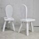 Pair of tripod chairs, gouged seats. Brutalist, circa 1960. Painted wood.