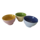 Set of three pastel two-tone mini bowls in glazed ceramic.