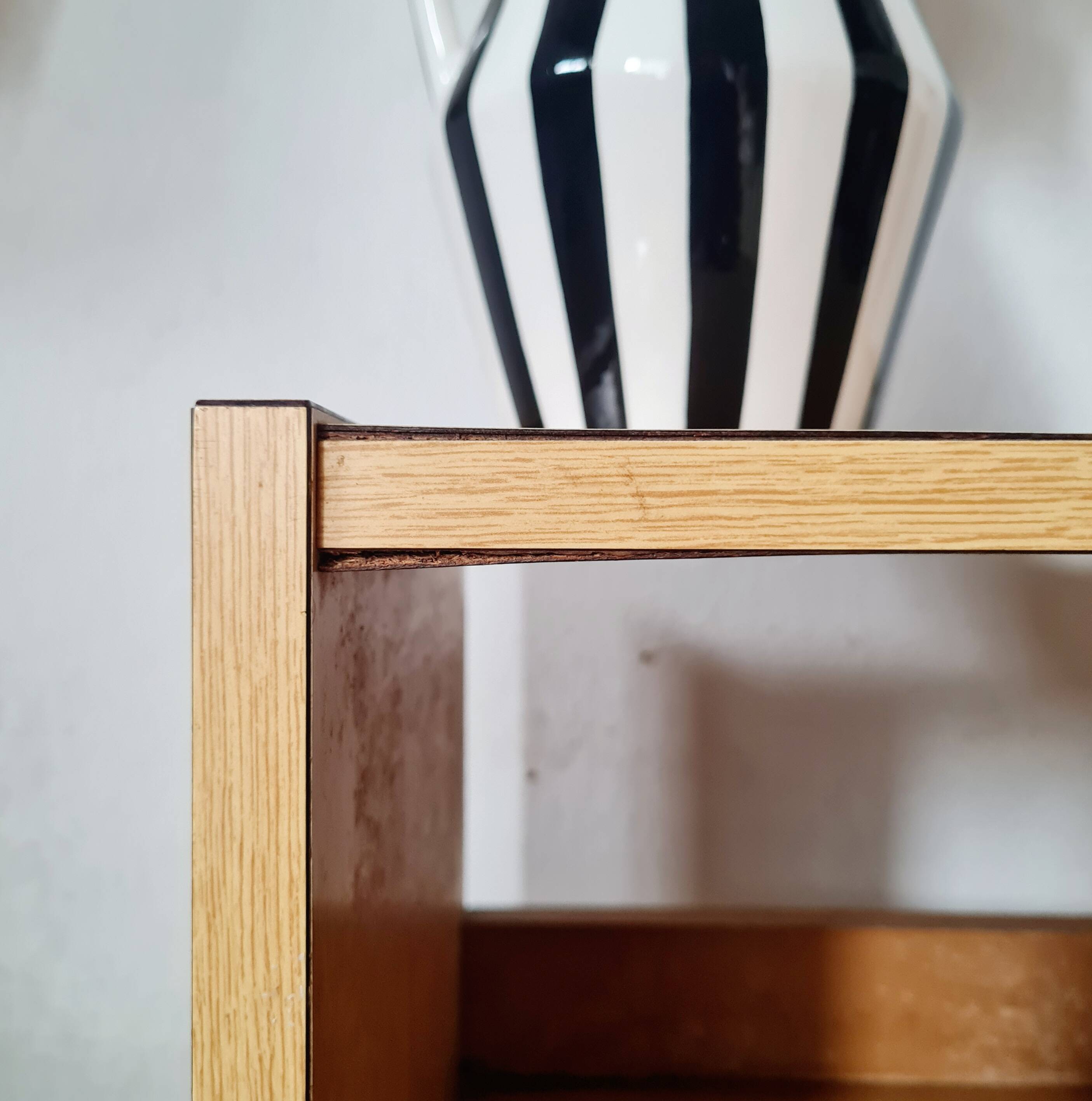 Bedside table - small wooden piece of furniture with a tubular metal base.