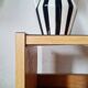 Bedside table - small wooden piece of furniture with a tubular metal base.