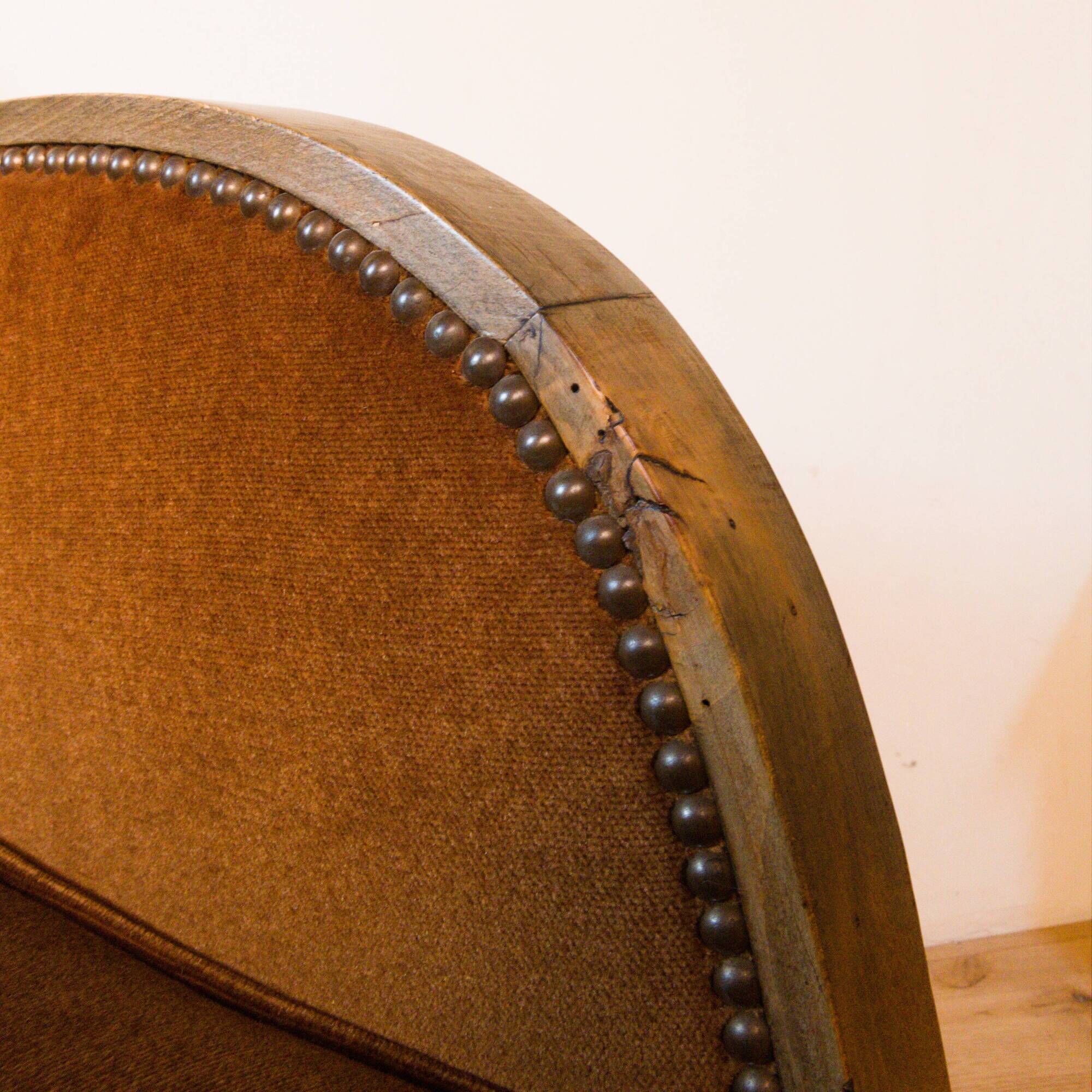 Art Deco club armchair in wood and rust brown velvet, circa 1930.