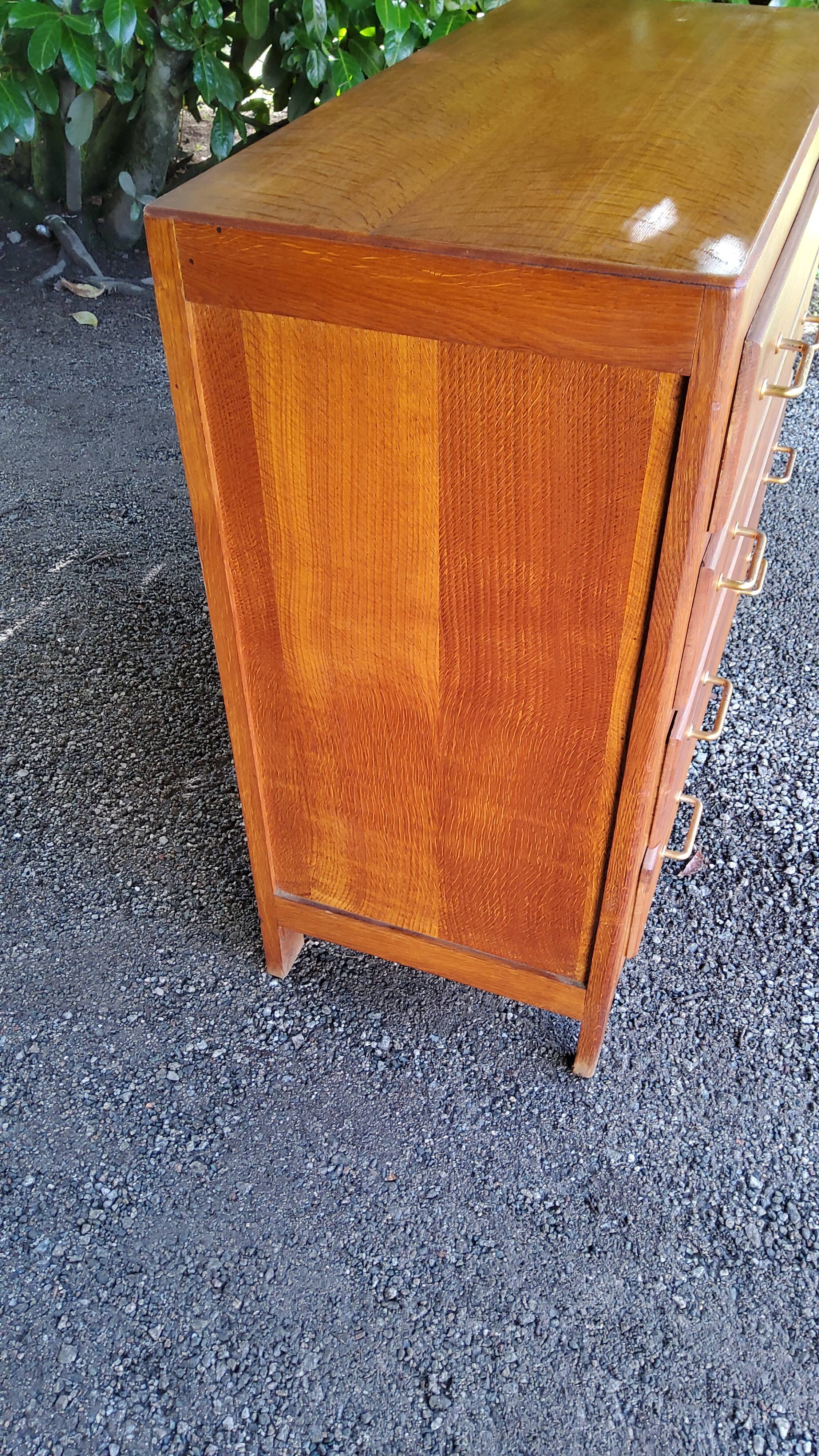 Chest of drawers of the 50s in oak compass feet 4 drawers