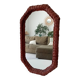 Vintage octagonal mirror in woven rattan.