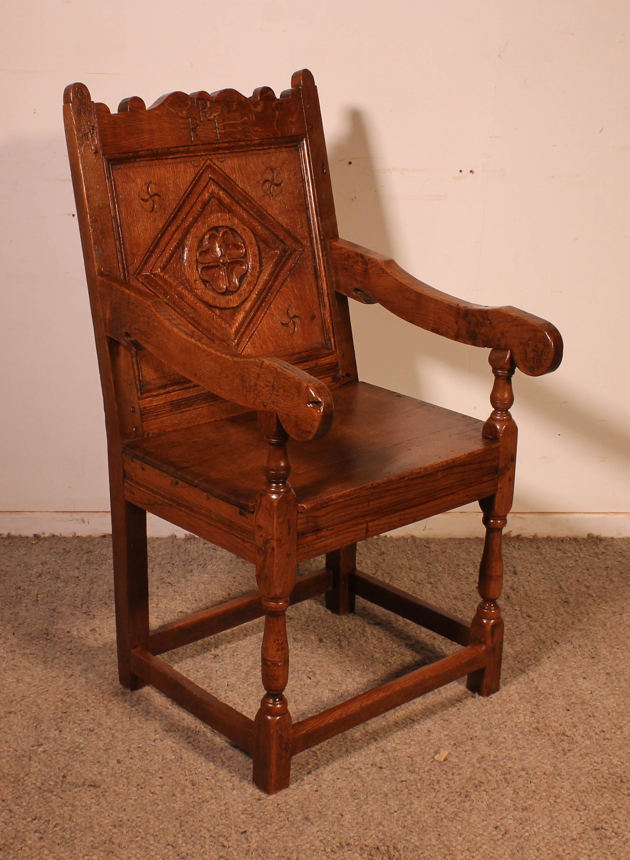 high-backed armchair from the 17th century in oak
