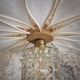 Suspension flower petals in rattan, white linen and vintage glass globe