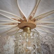 Suspension flower petals in rattan, white linen and vintage glass globe