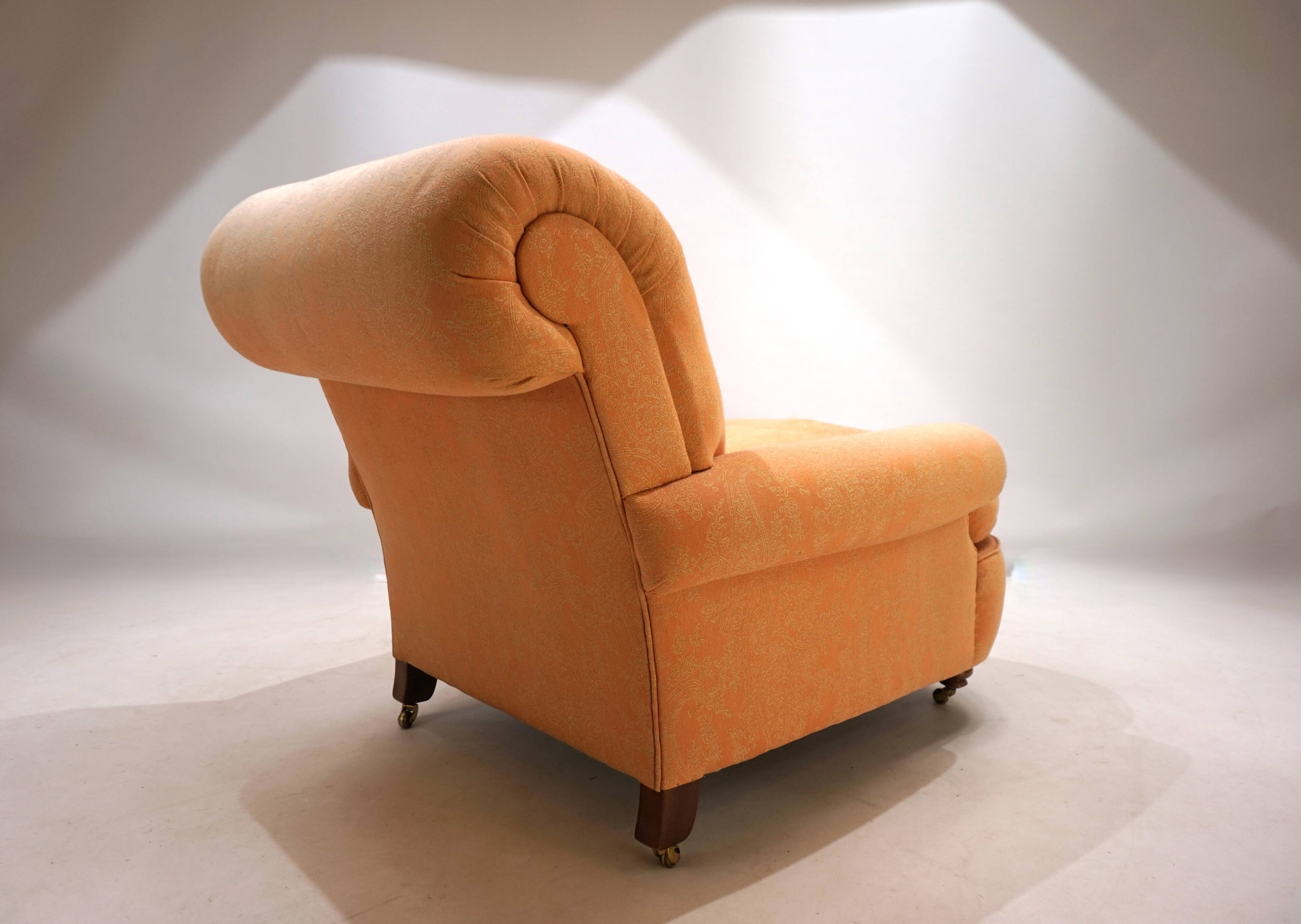 Deep seated armchair in the style of Howard & Sons