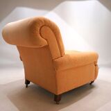 Deep seated armchair in the style of Howard & Sons