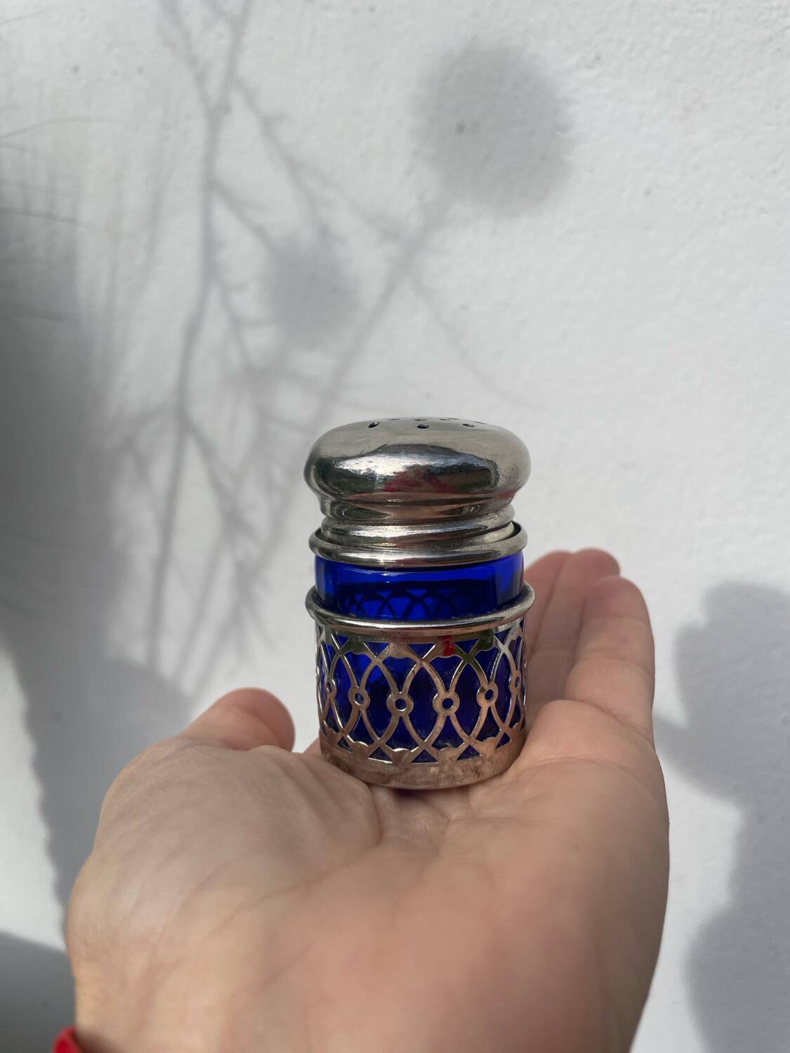 Silver-plated metal and blue glass salt and pepper shaker