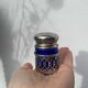 Silver-plated metal and blue glass salt and pepper shaker