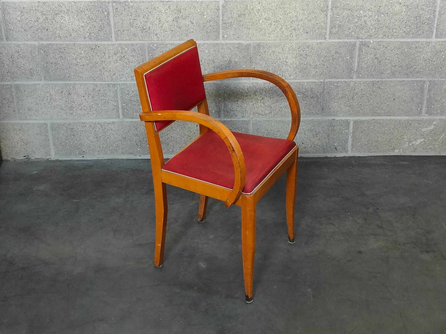 Small red bridge chair with armrests