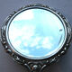 Face à main art nouveau miroir dans armature argent repoussé décor de roses 14x27cm