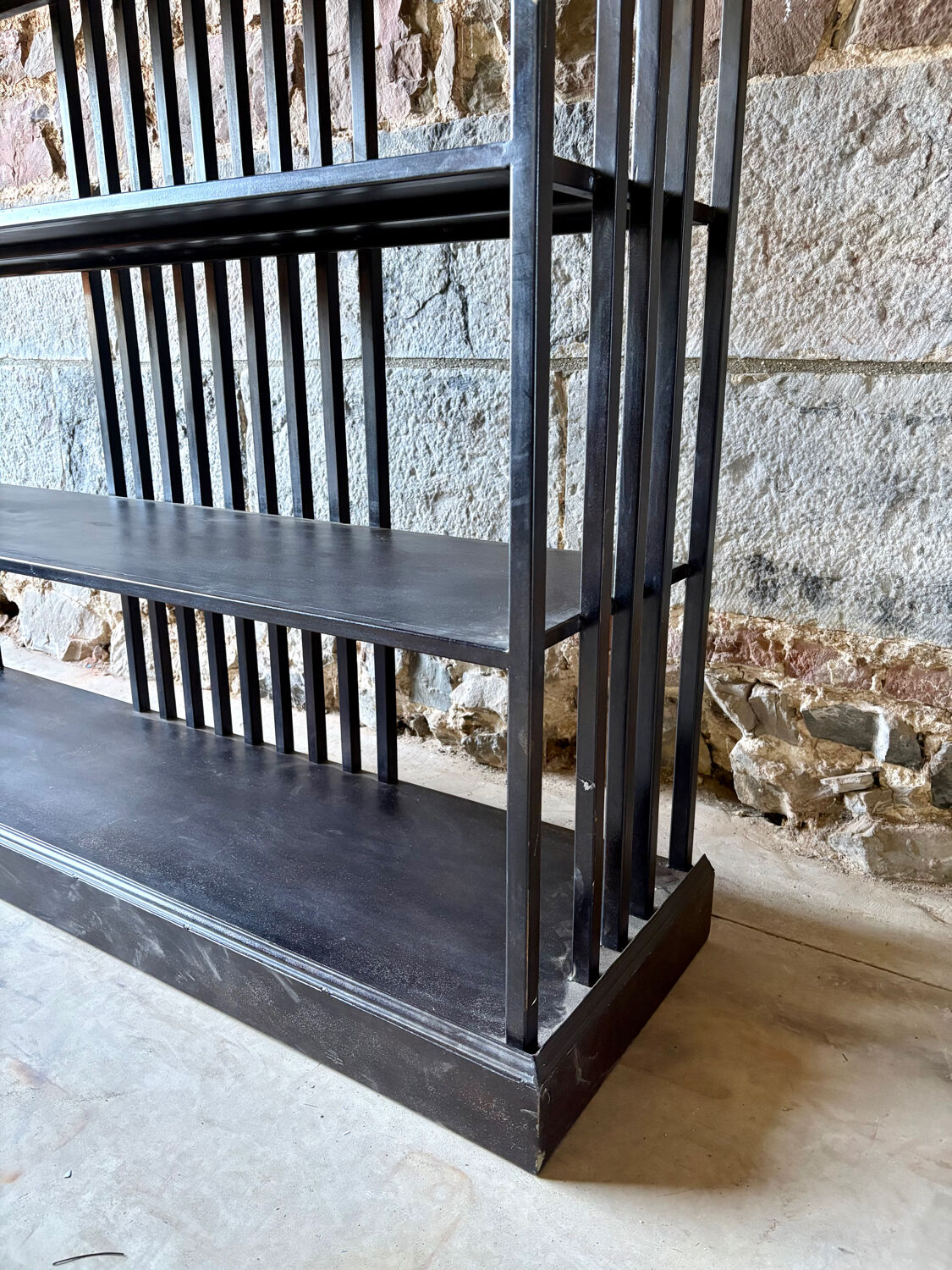 Large industrial black metal shelf – openwork graphic structure