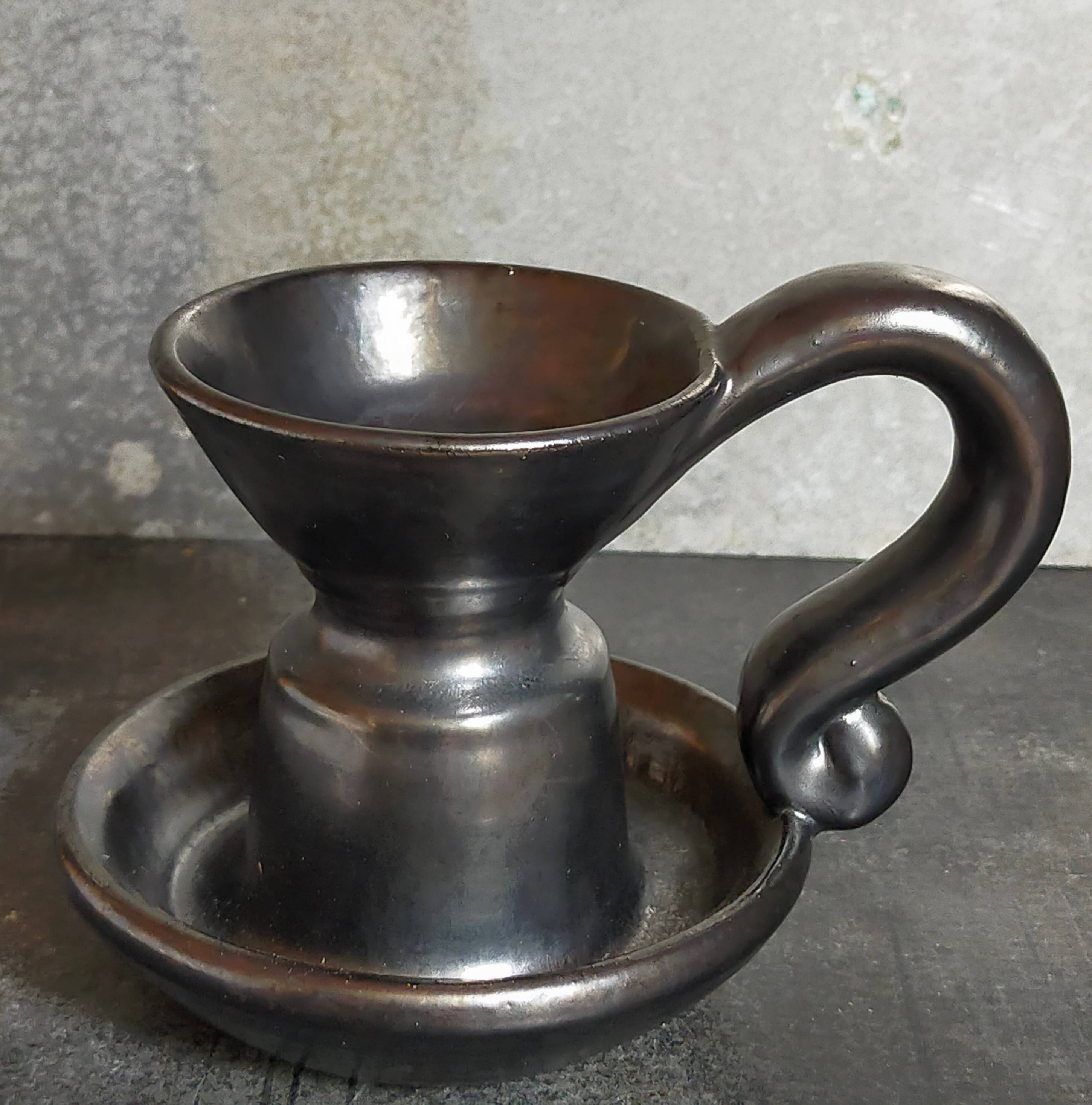 1950s iridescent black ceramic hand candle holder