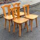 4 rounded Scandinavian dining chairs in solid pine from the 1980s.