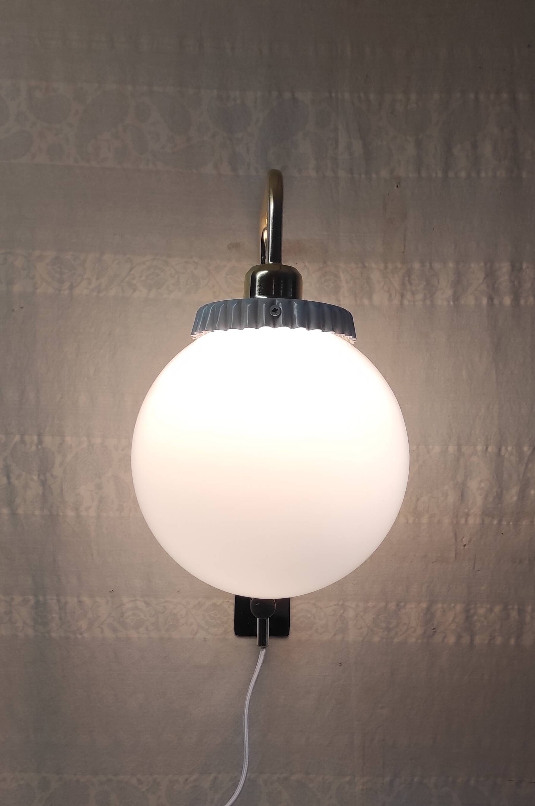 Opaline glass globe wall sconce with a gilt metal bracket - mid-20th century