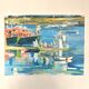 Oil on canvas signed, fishing port with colourful boats.