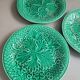 Three green slip plates