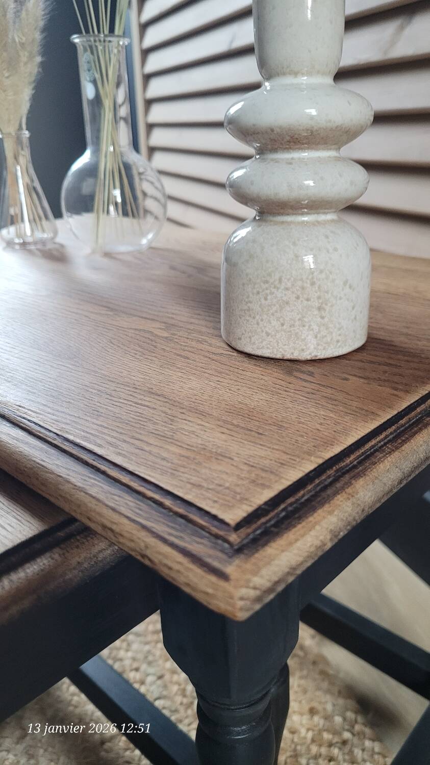 Nest tables in wood and black.