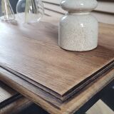 Nest tables in wood and black.