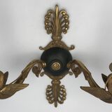 Antique bronze wall light with arm decorated with swans and palmettes in the Empire style