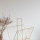 Vintage magazine holder in gold metal