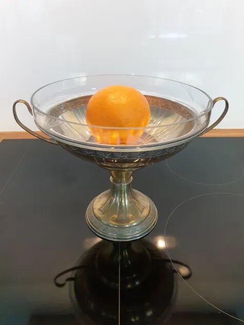 Art Deco brass cup and its engraved saucer.