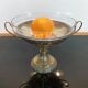 Art Deco brass cup and its engraved saucer.