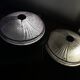 Pair of slightly pink glass ceiling lights and vintage black metal.