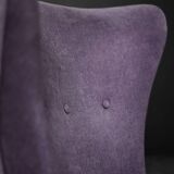 High-backed wing chair in oak and purple fabric, vintage Scandinavian style from the 1950s.