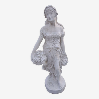 Statue of a woman winemaker in reconstituted stone