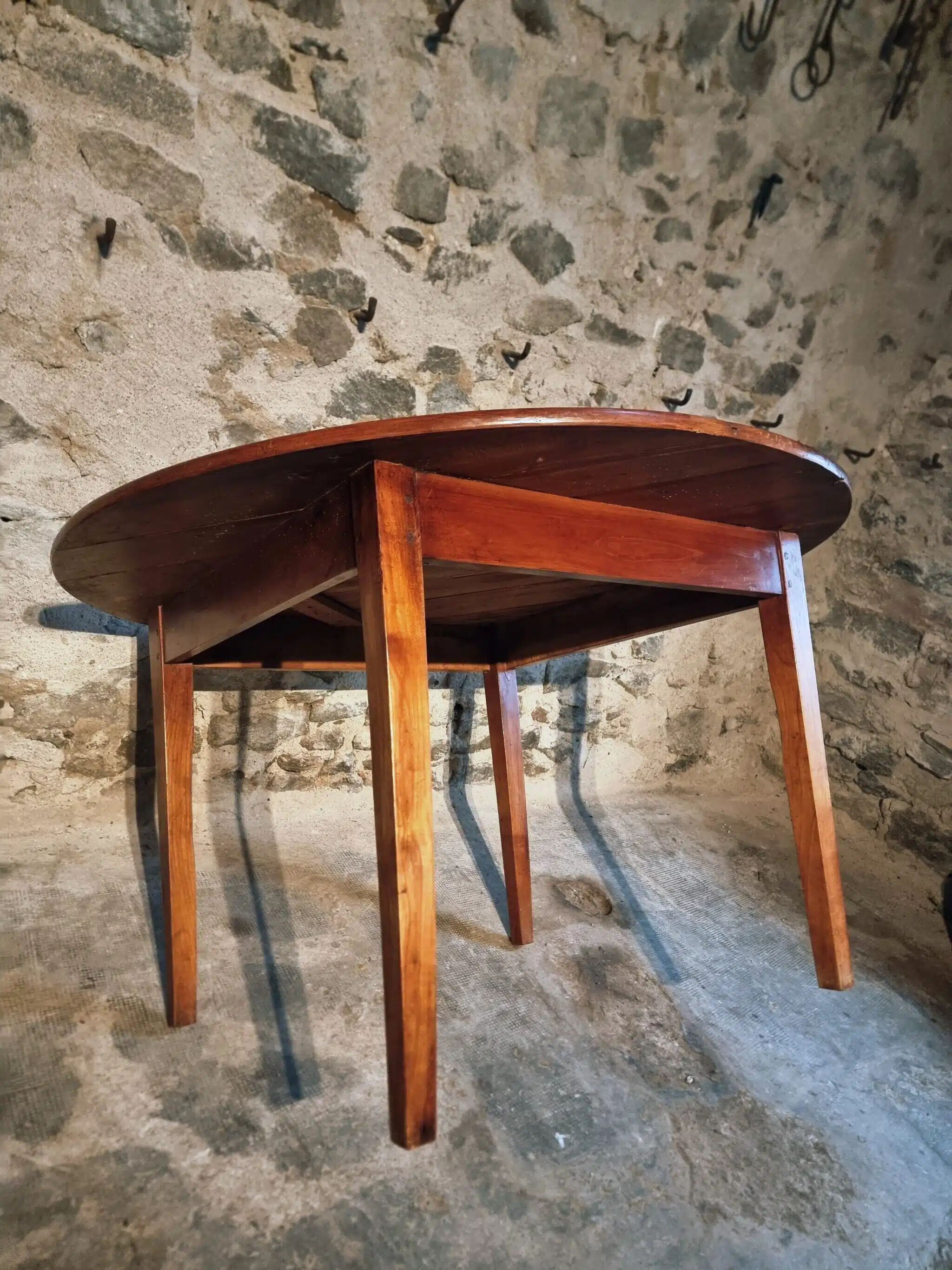 Vintage French round dining table in cherry wood, circa 1920.