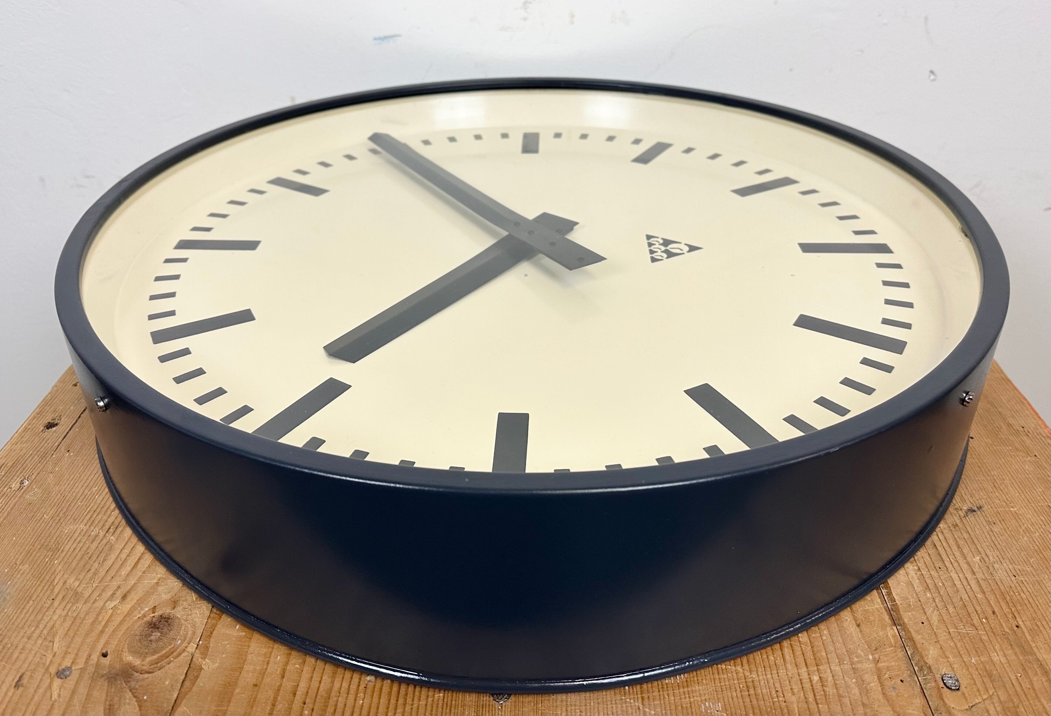 Grey industrial factory wall clock from pragotron, 1960s