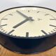 Grey industrial factory wall clock from pragotron, 1960s