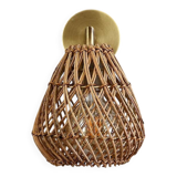 Golden bohemian wall lamp in woven rattan