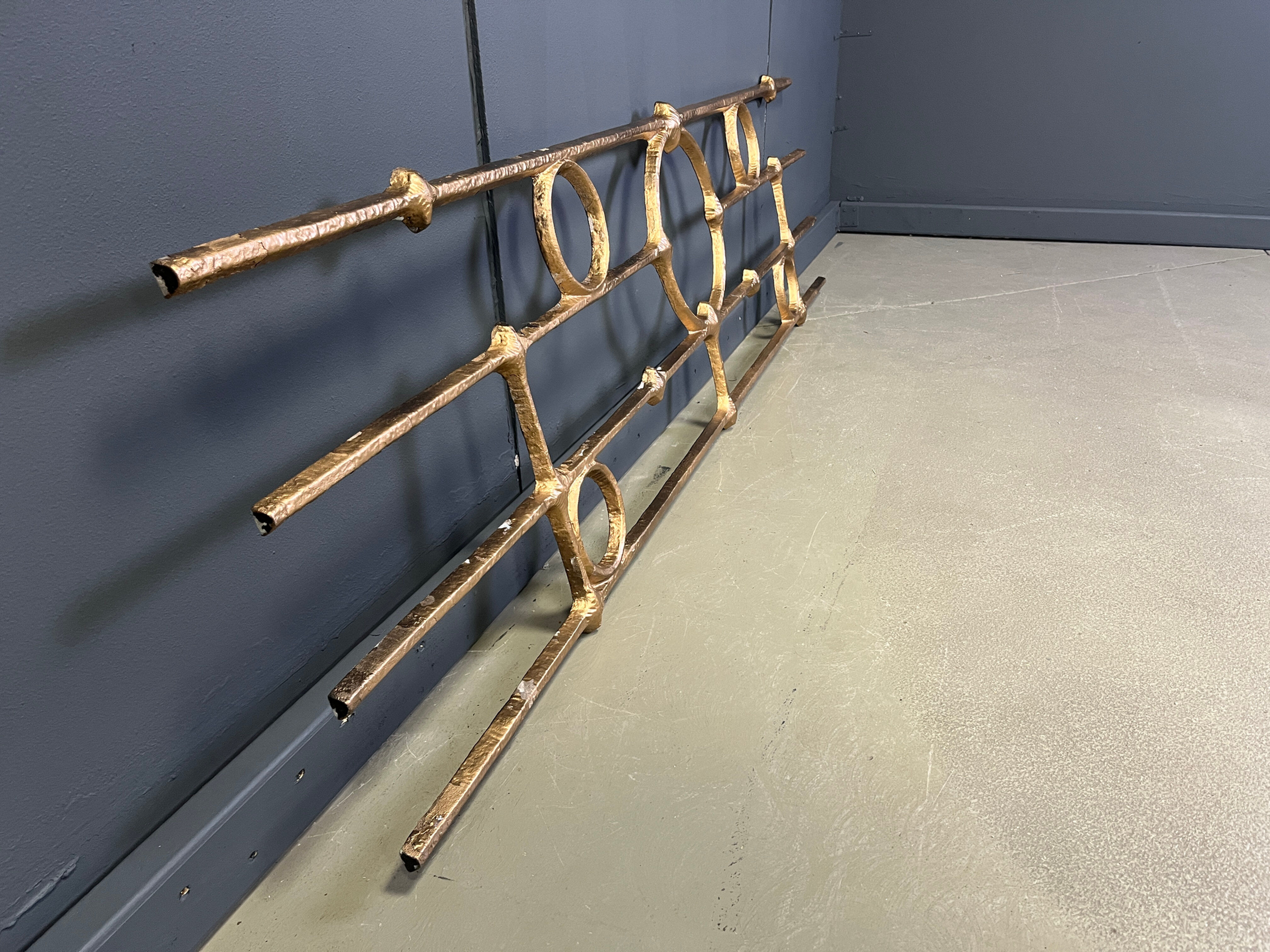 Architectural brutalist wall mounted sculpture made from cast metal.
