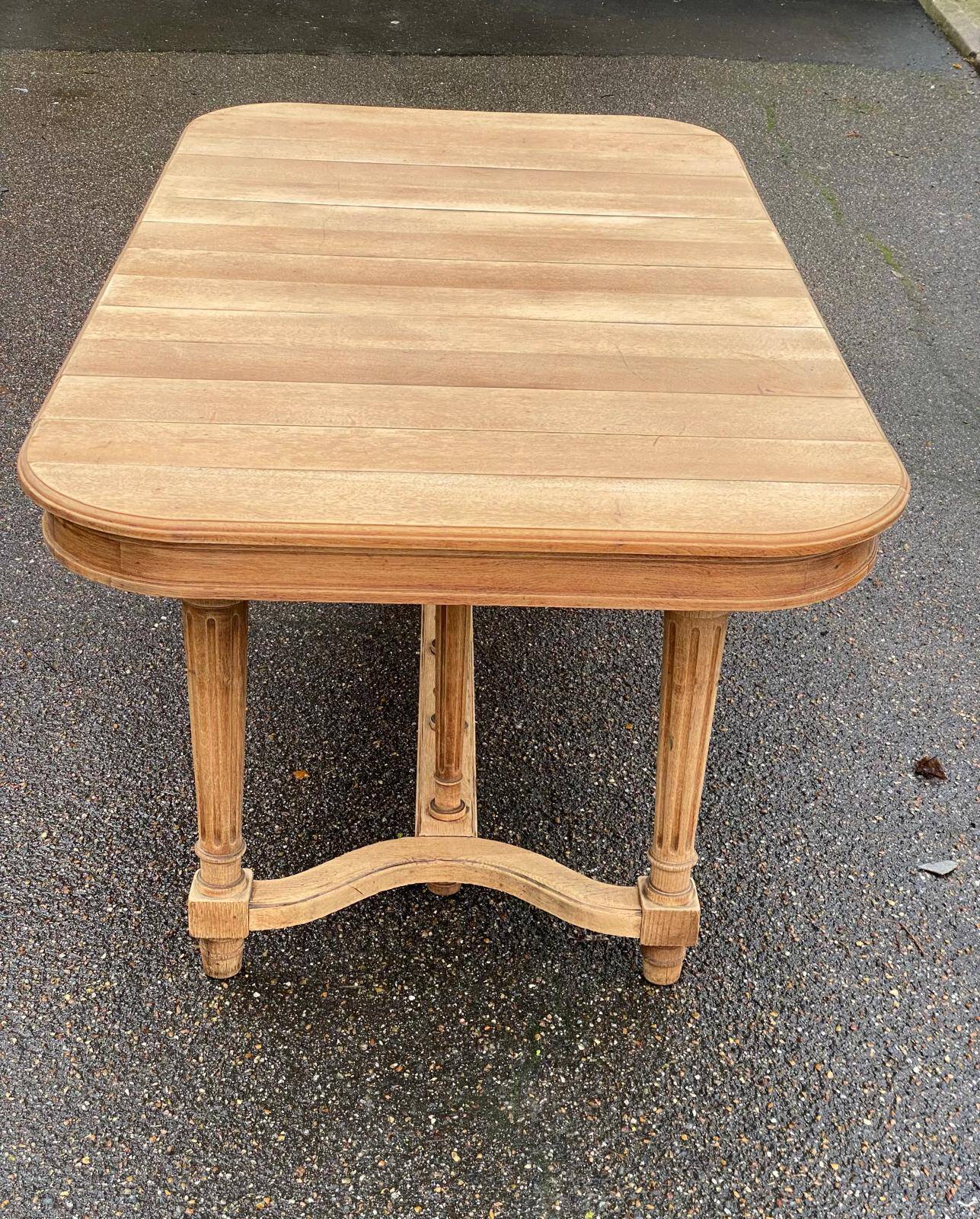 Renovated dining table in solid oak from the 19th century in Napoleon III style.
