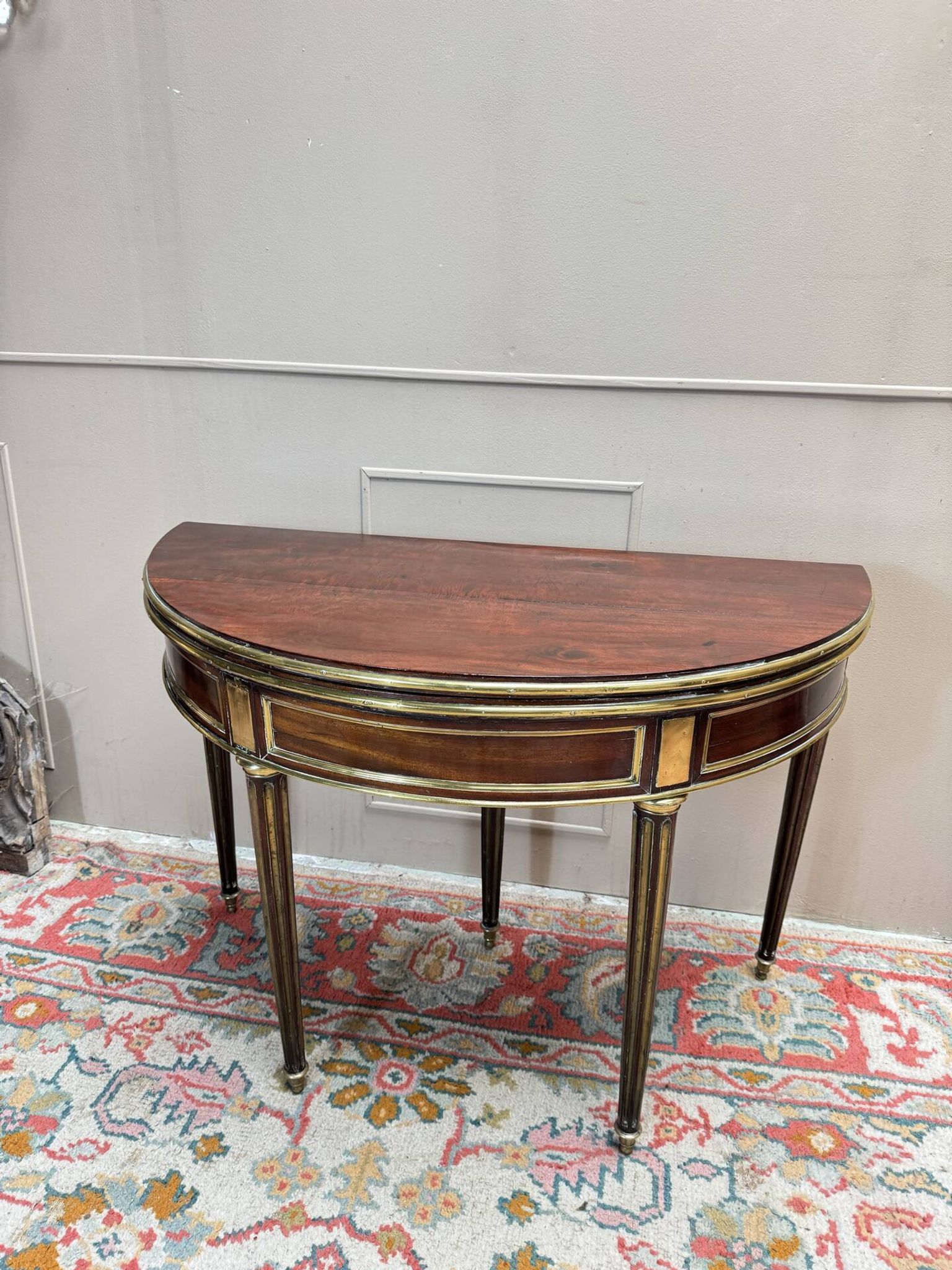 Half-moon table in mahogany from the Louis XVI period, 18th century.
