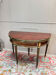 Half-moon table in mahogany from the Louis XVI period, 18th century.