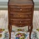 Louis XV bedside table in walnut, 3 drawers, raised edges on the tops.