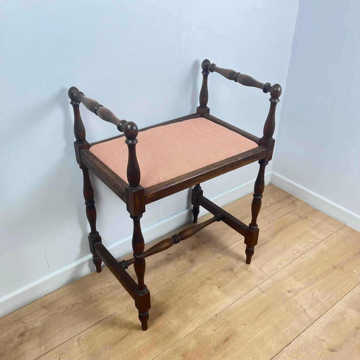 Small bench / stool in traditional English style, with side armrests.