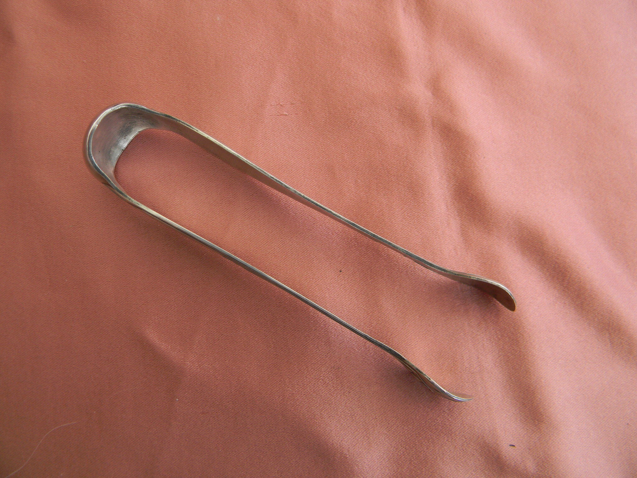 Art deco sugar tongs in silver metal