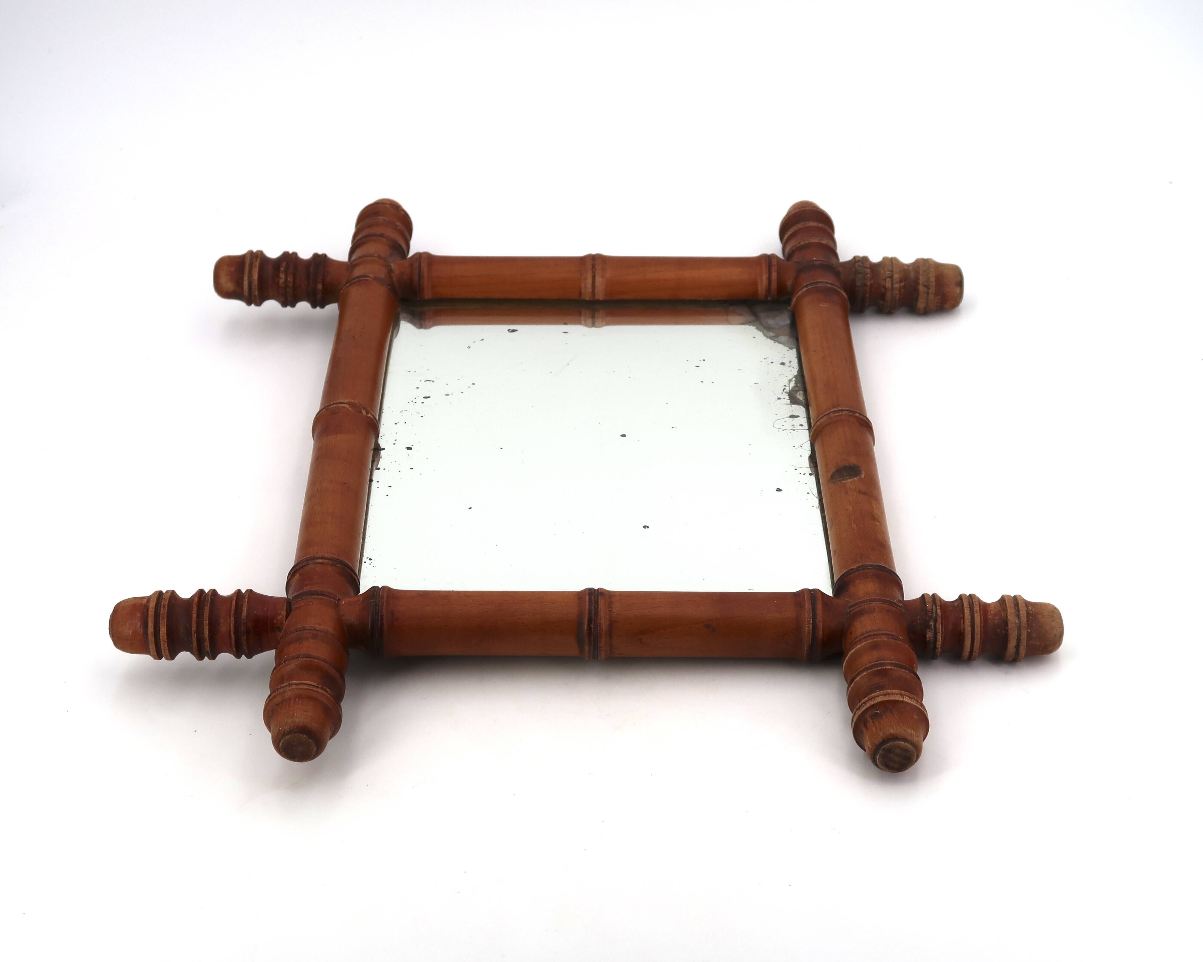 Small wall mirror in turned wood in a faux bamboo style, 1930s.